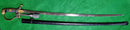 A Quality German WW2 Cavalry Officers Sword by Eickhorn Model Nr 1312. Leopard head pommel with ruby eyes. Complete with portepee and painted black scabbard.