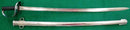 A Scarce Colonial Australian sword being an 1882 pattern British cavalry trooper’s sword and scabbard well marked with impressed numbers and letters N.S.W.G.C over C over 1256 over 00