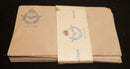 Fifteen R.N.Z.A.F. envelopes produced and sold by the Canteen Board for airmen to purchase to write home with. Still will paper tag to hold bundle together intact and also marked R.N.Z.A.F. with badge (Marked Canteen Board).