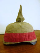 World War 1 German pickelhaube reversible manoeuver helmet cover. Four correctly stitched eyelets with correct brass hooks for helmet retention. Spike top held by tabs to allow for ventelation. No tears or mothing. Very good condition. SOLD