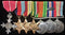 GH19: Seven: MBE Military, 1939-45 Star, Africa Star and Pacific Stars (all small letter impressed) Defence medal, War medal MID and ASM (all impressed) SX 6032 Captain J. S. Greene AASC.