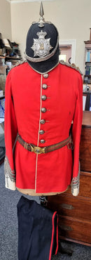 A Victorian Blue Cloth Helmet, Tunic with belt and trousers to Lieutenant Colonel Sapwell circa 1880 who was CO of the 3rd NORFOLK Volunteer Rifles.