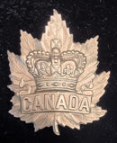 A Large White Metal Canadian Boer War period hat badge with J. R. Gaunt London makers plate complete with both lugs.