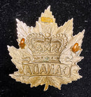 A Large White Metal Canadian Boer War period hat badge with J. R. Gaunt London makers plate complete with both lugs.