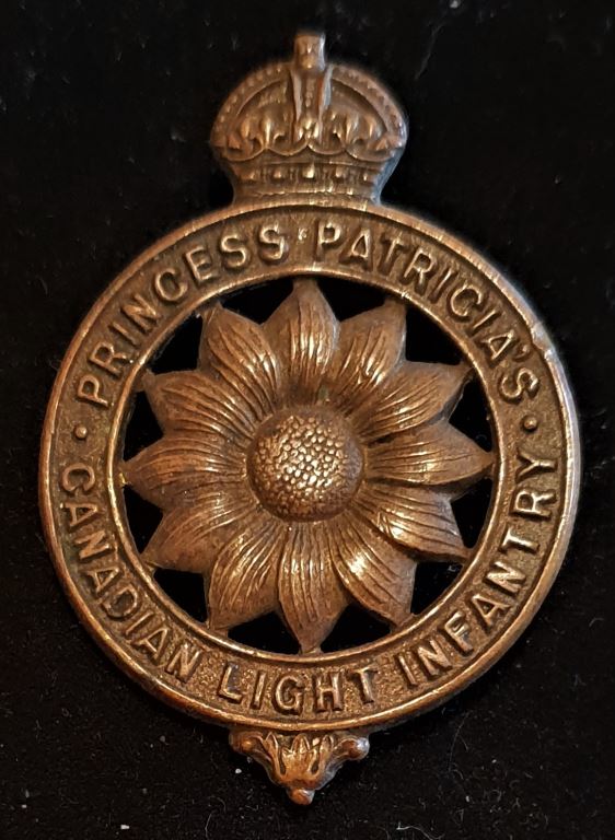 5-2, PRINCESS PATRICIA’S CANADIAN LIGHT INFANTRY “MARGUERITE” CAP BADGE (NORTH SOUTH LUGS WITH ONE MISSING)