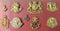 A Selection of 9 KINGS COLONIAL INSIGNIA. A very fine carded display of unissued examples. All with original Gilt. This collection of badges comes from the original J.R. Gaunt and Son Ltd - SOLD