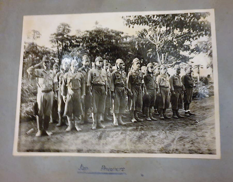 Photograph album containing 79 original WW2 period photos taken in Papua New Guinea. The Album was compiled together by Corporal Raymond George Ball, 6 AA Topographical Survey Coy
