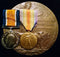 Three: British war and Victory medal with Memorial Plaque. Medals impressed to 29915 PTE E. PEARCY NORF. R. Memorial Plaque: Correct one piece cast named to ERNEST PEARCEY - EF SOLD