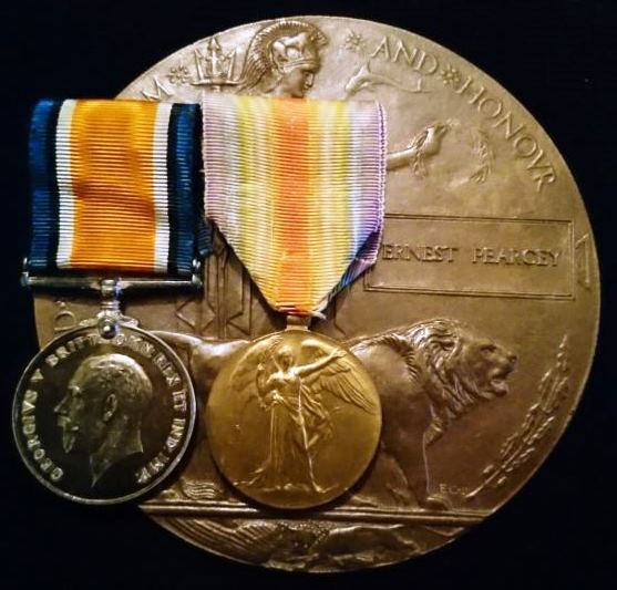 Three: British war and Victory medal with Memorial Plaque. Medals impressed to 29915 PTE E. PEARCY NORF. R. Memorial Plaque: Correct one piece cast named to ERNEST PEARCEY - EF SOLD
