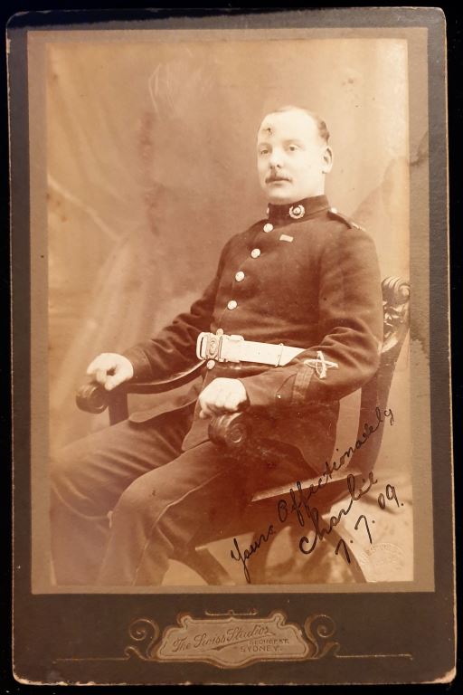 Photo of a Royal Marine soldier wearing crossed rifles and the ribbon for the China 1900 Medal signed “Yours Affectionately, Charlie 7.7.09” taken at The Swiss Studios George St Sydney.