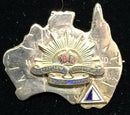 Rising Sun in the center of Australia in Sterling Silver with gilt wash and an Australian Army Service Corps colour patch.