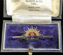 Traditional Rising Sun design marked 9 CT with detailed enamel  in "GEO. P. HARRIS SCARFE & CO LTD" jewelers Adelaide case.