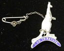 Kangaroo standing on top of the phrase.   "I GO TO RETURN" inside a blue enamel bomerang.  Marked Sterling & registration No with chain.