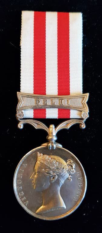 Single: Indian Mutiny Medal 1857-58 one clasp "DELHI" impressed naming to CORPL S. COTTERILL 52ND L. I. - GOOD VF SOLD