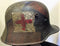 An outstanding WW1 Austrian/German M18 camouflage Steel helmet. Typical 3 colour camouflage with black dividing lines. - SOLD