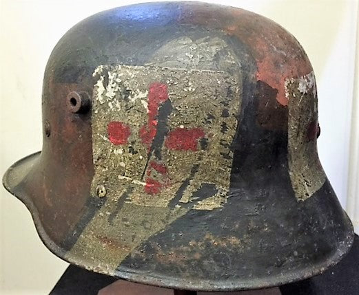 An outstanding WW1 Austrian/German M18 camouflage Steel helmet. Typical 3 colour camouflage with black dividing lines. - SOLD