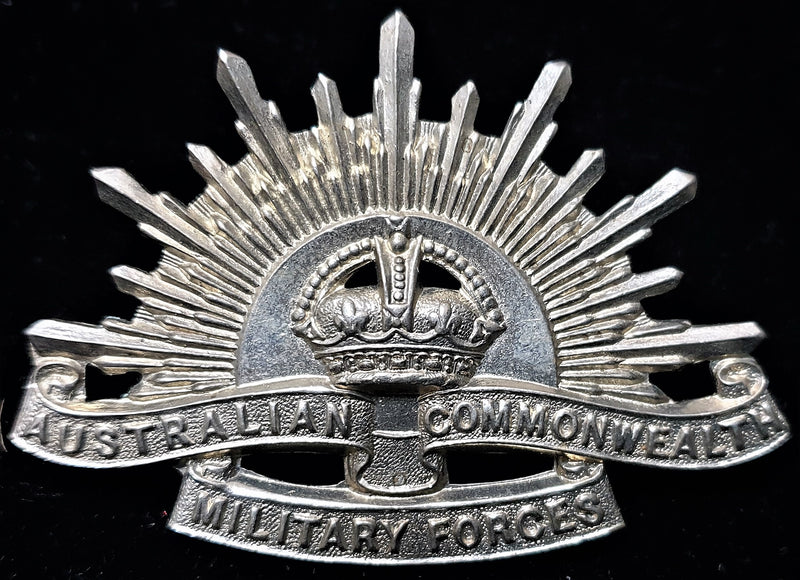 Rare example of a WW2 era Armoured Corps  White metal Rising Sun Hat Badge.  Note the “Halo” between the rays of the sun.  Never encountered this variety before  - SOLD
