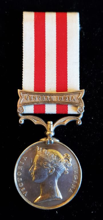 Single: Indian Mutiny Medal 1857-58 one clasp "CENTRAL INDIA" impressed naming to COLR SERJT J. F. STEVENS. 86TH REGT.  Confirmed on medal roll as Colour Sergeant J. Stephens - Near EF SOLD
