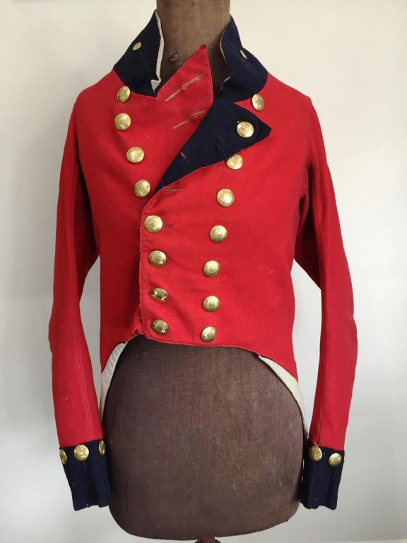 A rare Georgian Officers coatee in amazing condition circa 1810. Scarlet cloth with dark blue facings, complete with all its gilt buttons (40) and gilt metal stringed bugles on the wings - SOLD