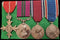 Four: MBE type2 (Military), MSM Commonwealth of Australia G. V. R. 59 WO 1 A. B. Webber A.I.C.,